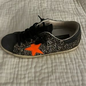 Sparkly black with orange star Golden Goose!! Worn a few times!!